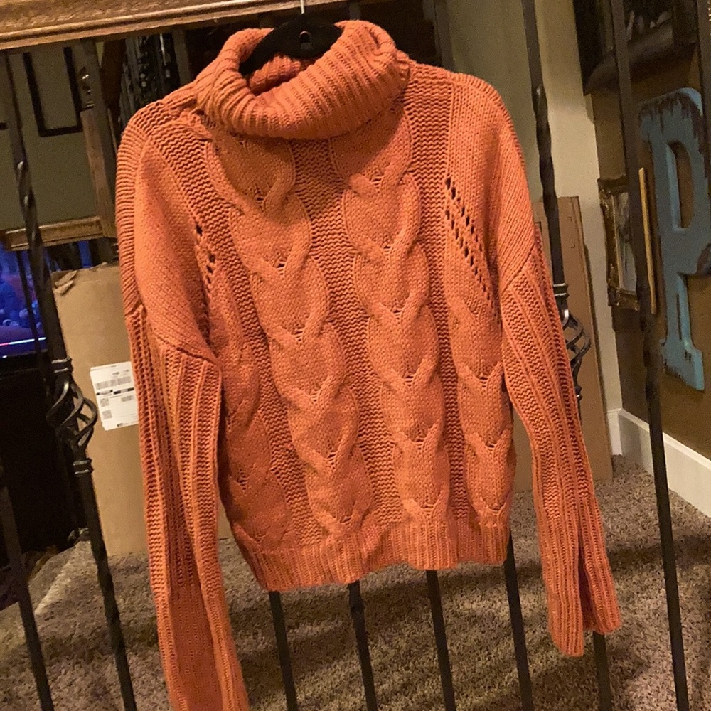 orange turtleneck sweater